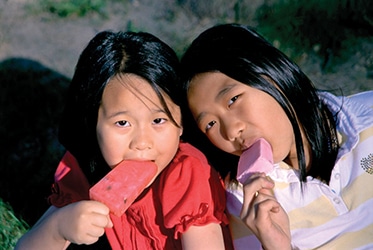 girls eating ice cream pops