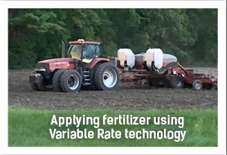 applying fertilizer with tractor