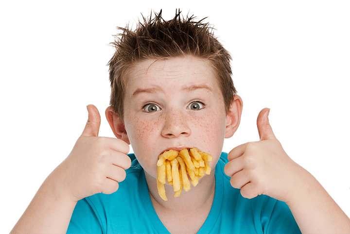 boy with mouth full of french fries