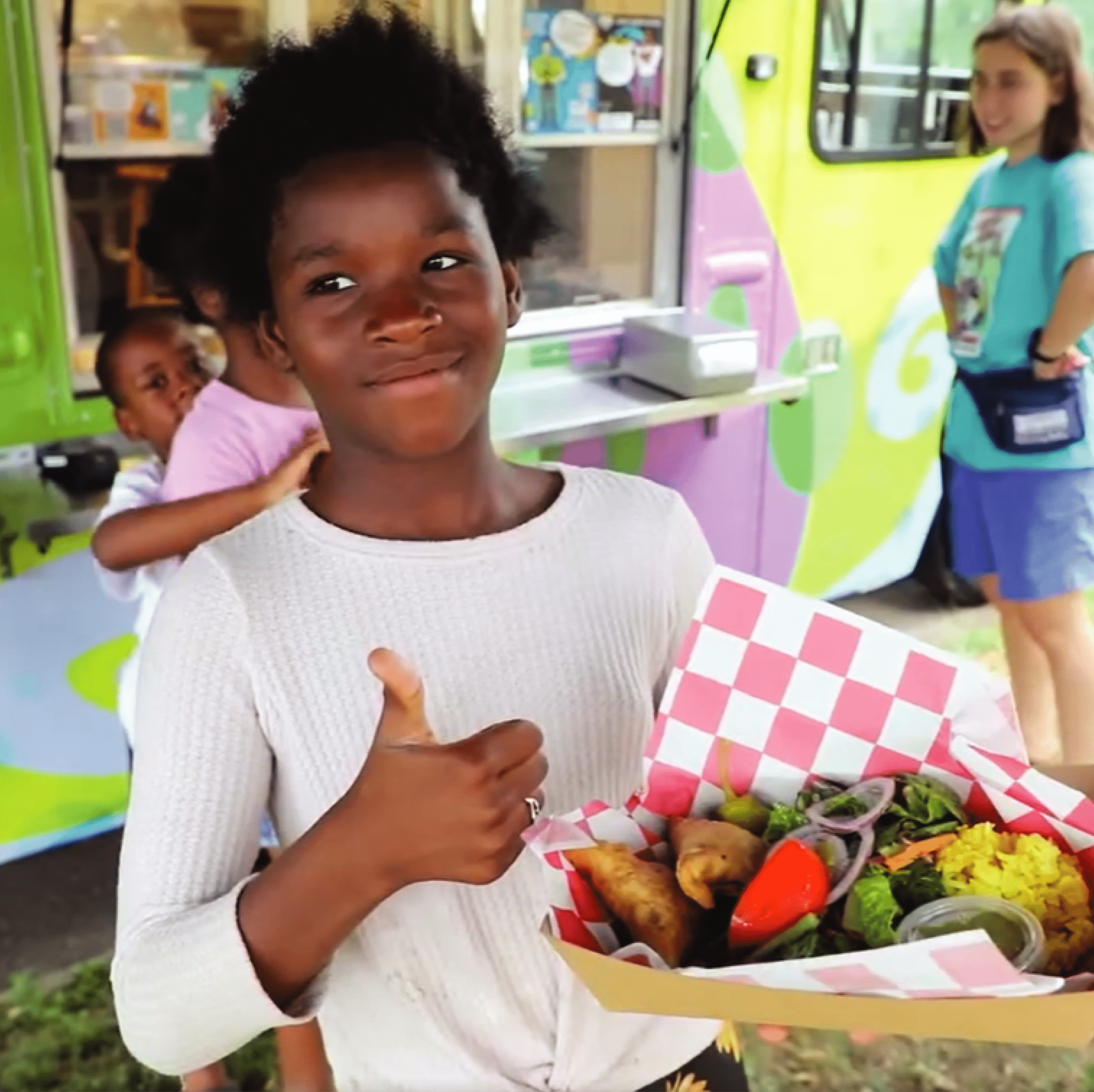 Student Posing with Sambusa Meal