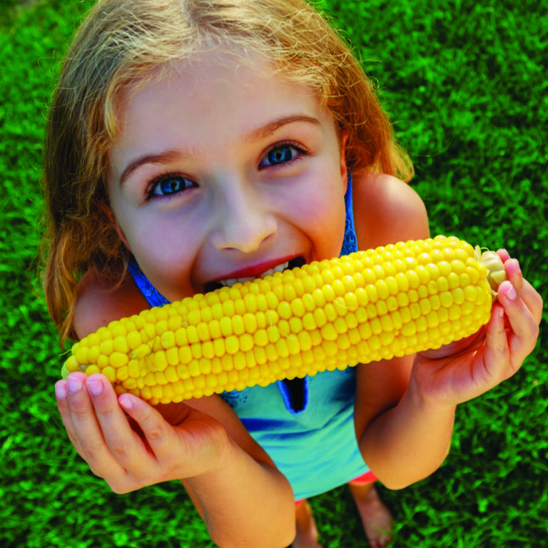 Girl Eating Corn